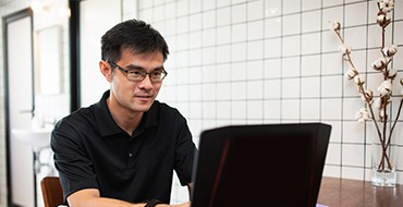 man working on laptop computer